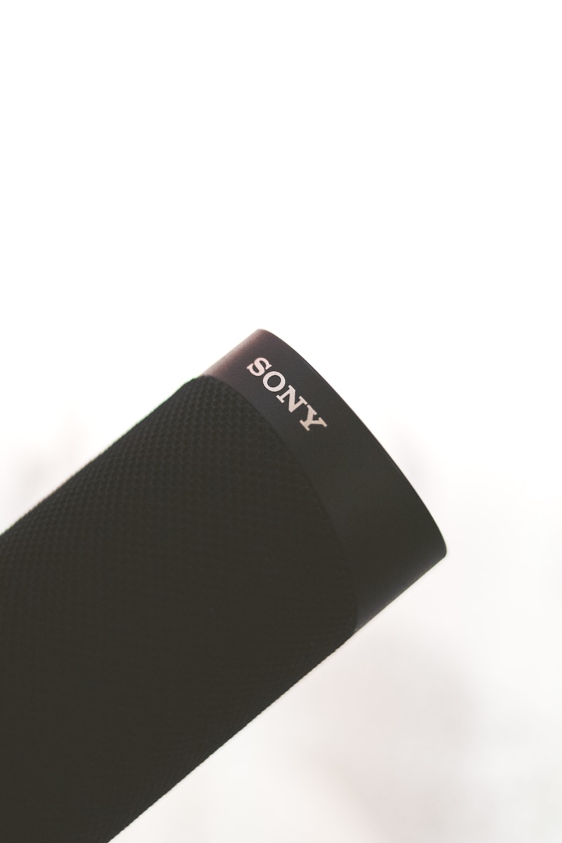 a close up of a cell phone on a white surface